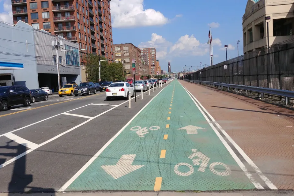 Green painted bike lane with delineators in Hoboken, New Jersey